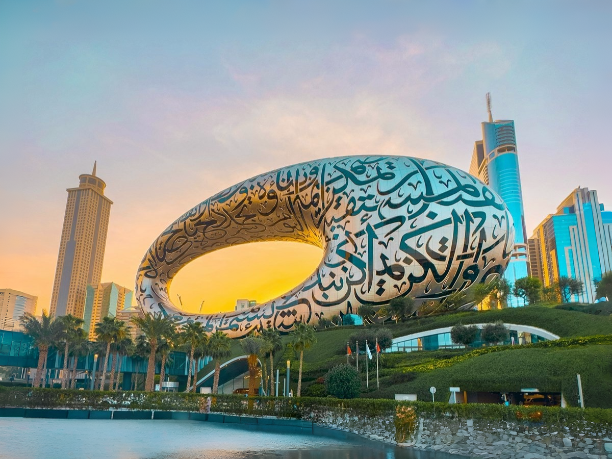 Burj Khalifa skyline and Dubai city illuminated at sunset