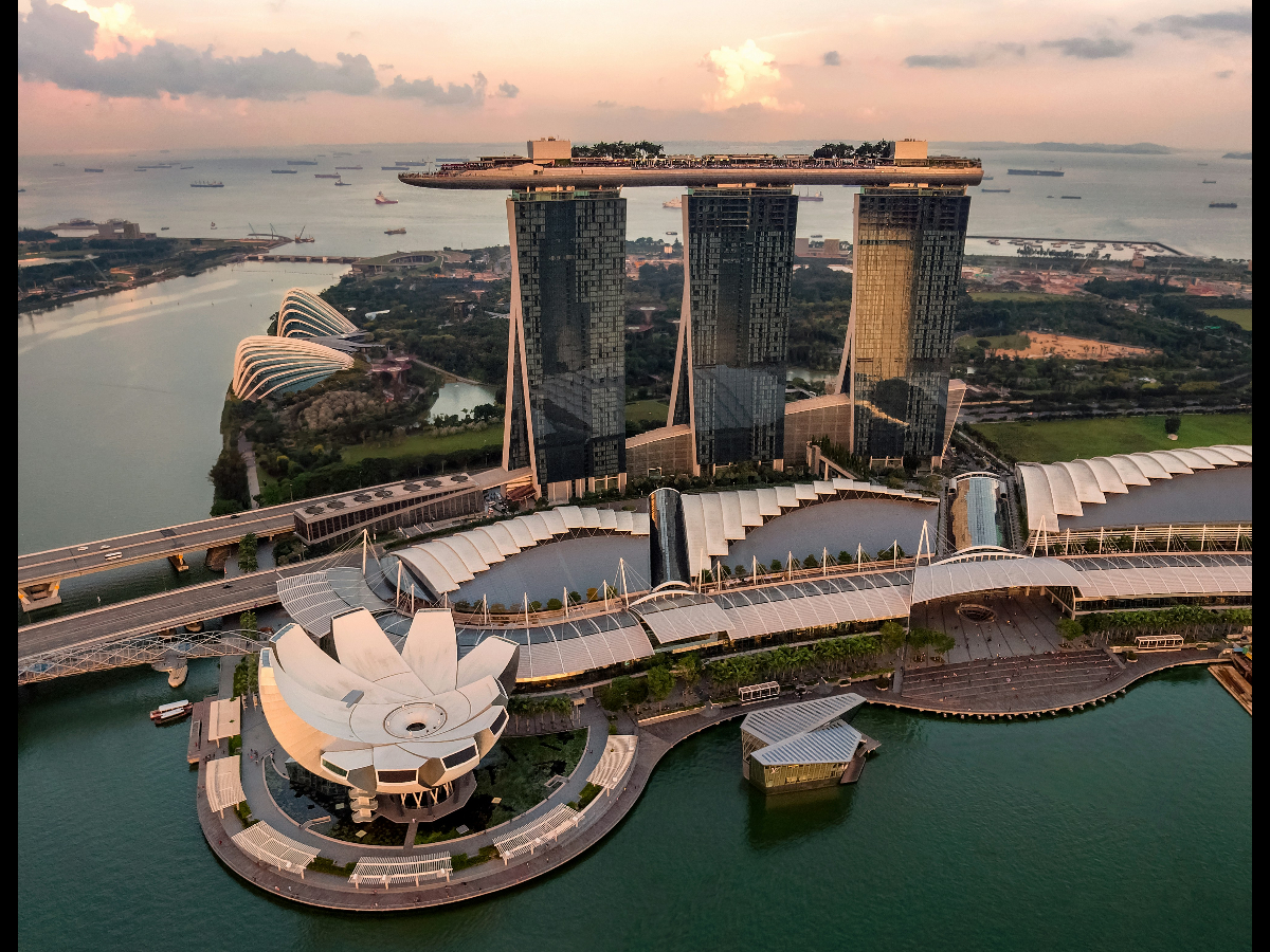 Marina Bay Sands and Gardens by the Bay illuminated at night in Singapore