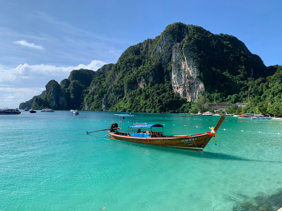 Long-tail boat on the turquoise waters of Phi Phi Island, Thailand